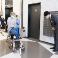 Japanese Management Board greets residents in apartment lobbies