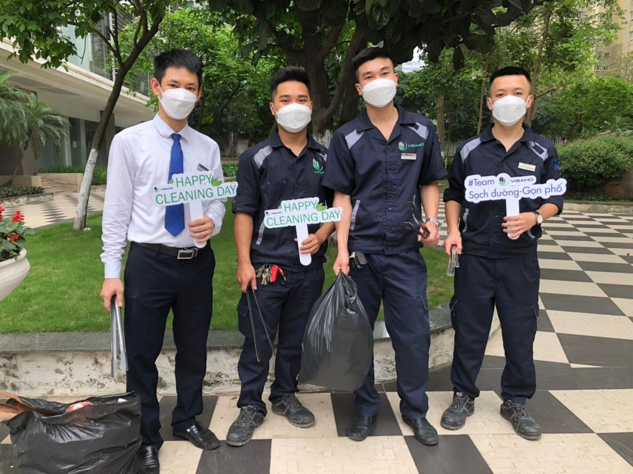 Staff members participate in activities of picking up trash to clean up the environment of VISAHO